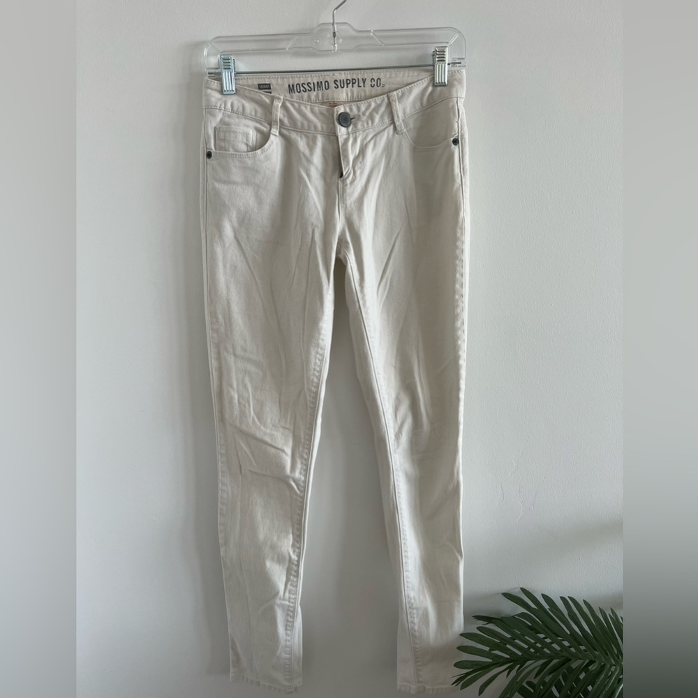 White stretchy, midrise pants.